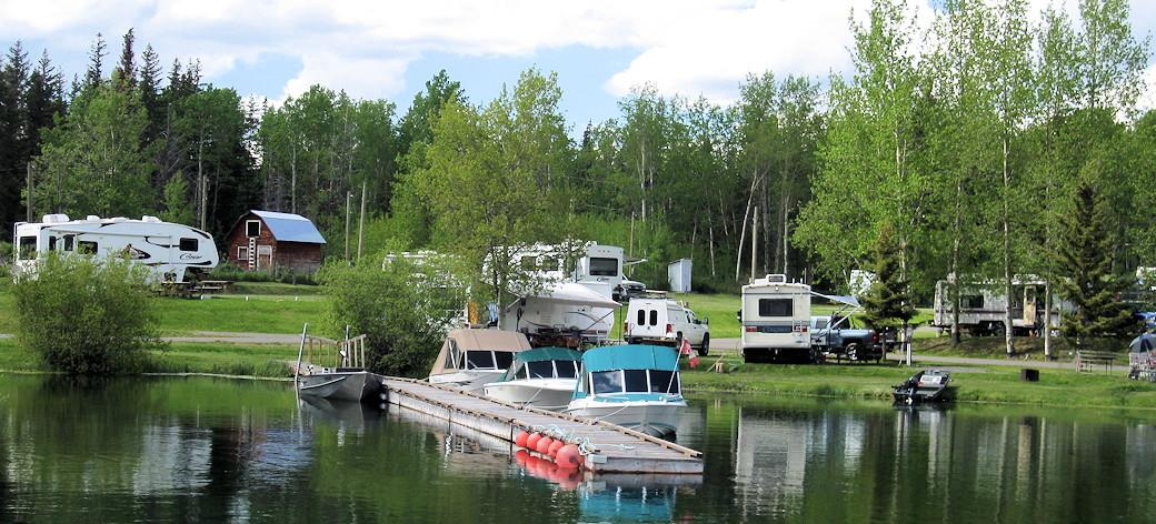 lake-dock-with-motor-boats-and-RV-parks-in-background.jpg